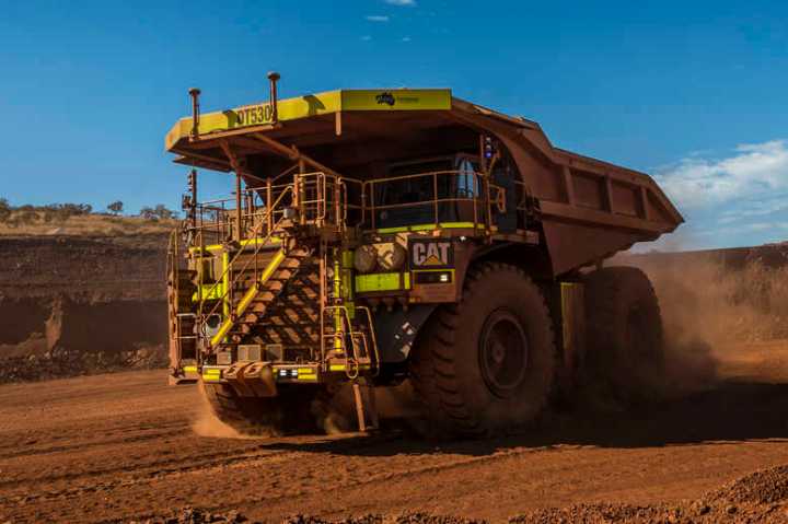 Cat 793F CMD Mining Truck leaving iron ore pit